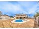 Back of the house with a unique pool and large yard area at 5751 E Owens Ave, Las Vegas, NV 89110