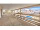 Spacious balcony with pool and neighborhood views framed by a decorative railing at 5751 E Owens Ave, Las Vegas, NV 89110