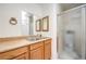 Functional bathroom features a double sink vanity and a glass-enclosed shower stall at 5751 E Owens Ave, Las Vegas, NV 89110