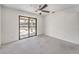 Bright bedroom with sliding glass door that provides backyard access and natural light at 5751 E Owens Ave, Las Vegas, NV 89110