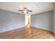 A large bedroom featuring wood laminate flooring and a ceiling fan at 5751 E Owens Ave, Las Vegas, NV 89110