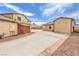 Long driveway leading to a detached garage and backyard at 5751 E Owens Ave, Las Vegas, NV 89110
