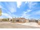 Charming two-story home with desert landscaping, spacious driveway, and secure gated entrance at 5751 E Owens Ave, Las Vegas, NV 89110