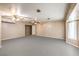 Spacious living area with ceiling fans, neutral paint, and abundant space for flexible layouts at 5751 E Owens Ave, Las Vegas, NV 89110