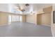 Expansive living room with dual ceiling fans and large windows offering plenty of natural light at 5751 E Owens Ave, Las Vegas, NV 89110