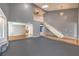 The expansive living area has high ceilings, staircase, and an opening that shows the kitchen at 5751 E Owens Ave, Las Vegas, NV 89110
