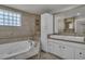 Elegant bathroom with a soaking tub, dual sinks, and custom tile work for a spa-like experience at 60 E Levi Ave, Las Vegas, NV 89183