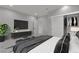 Bright bedroom with neutral walls, tile floors, closet organizer, and entertainment center at 60 E Levi Ave, Las Vegas, NV 89183