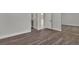 A bonus room with wood flooring and a view into the bathroom offers versatility and convenience at 60 E Levi Ave, Las Vegas, NV 89183