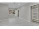 Large bonus room with a window overlooking the backyard and custom shelving units for storage and decor at 60 E Levi Ave, Las Vegas, NV 89183