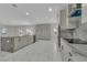 Modern kitchen featuring granite countertops, stainless steel appliances, and marble floors at 60 E Levi Ave, Las Vegas, NV 89183