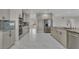 Open kitchen featuring granite countertops, stainless steel appliances, and marble floors at 60 E Levi Ave, Las Vegas, NV 89183