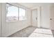 Bedroom features neutral carpet, window, and doorway to other rooms at 603 W Adams Ave, Las Vegas, NV 89106