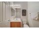Cozy bathroom with a single sink vanity, mirror, decorative art, and tub/shower combo at 6255 W Arby Ave # 193, Las Vegas, NV 89118