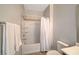 Clean bathroom featuring a tiled shower-tub combo with a white shower curtain at 6255 W Arby Ave # 193, Las Vegas, NV 89118