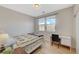 Bedroom featuring two windows and a desk at 6255 W Arby Ave # 193, Las Vegas, NV 89118