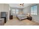 Bright bedroom with hardwood floors, ample natural light, and a ceiling fan at 6255 W Arby Ave # 193, Las Vegas, NV 89118