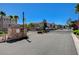 Gated community entrance with well-maintained landscaping and secure access, plus a resident mailbox at 6255 W Arby Ave # 193, Las Vegas, NV 89118