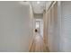 Hallway featuring light colored walls and wood look flooring at 6255 W Arby Ave # 193, Las Vegas, NV 89118