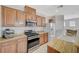 Charming kitchen featuring granite countertops, stainless steel appliances, and wooden cabinetry at 6255 W Arby Ave # 193, Las Vegas, NV 89118
