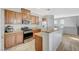Charming kitchen with granite countertops, stainless steel appliances and view of living area at 6255 W Arby Ave # 193, Las Vegas, NV 89118