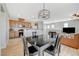 This open floor plan showcases a kitchen with wood cabinets and a breakfast bar at 6255 W Arby Ave # 193, Las Vegas, NV 89118