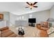 Open-concept living area with hardwood floors and a cozy seating arrangement at 6255 W Arby Ave # 193, Las Vegas, NV 89118