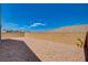 This property features a low maintenance backyard with desert landscaping and block wall at 8286 Skye Gorge St, Las Vegas, NV 89166