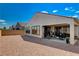 Backyard features a covered patio, desert landscaping, and seamless indoor/outdoor living at 8286 Skye Gorge St, Las Vegas, NV 89166