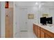 Bathroom featuring a double vanity, large mirror, and separate toilet and shower areas at 8286 Skye Gorge St, Las Vegas, NV 89166