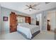 Comfortable bedroom with a ceiling fan, neutral paint, and a mirrored wardrobe for added space at 8286 Skye Gorge St, Las Vegas, NV 89166