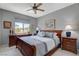 Comfortable bedroom with a ceiling fan, a large window, and coordinated furniture at 8286 Skye Gorge St, Las Vegas, NV 89166