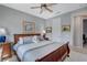 A well-lit bedroom offering neutral tones and features a comfortable-looking bed and ceiling fan at 8286 Skye Gorge St, Las Vegas, NV 89166