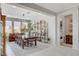 Elegant dining room with large table, stylish decor, and easy access to the outdoor patio at 8286 Skye Gorge St, Las Vegas, NV 89166