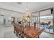 Charming dining area with a large table and decorative shelving with easy access to the kitchen at 8286 Skye Gorge St, Las Vegas, NV 89166