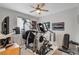 A dedicated exercise room featuring various workout machines, fitness equipment, and a ceiling fan at 8286 Skye Gorge St, Las Vegas, NV 89166