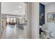 Bright hallway leading to the dining area, showcasing elegant tile flooring and neutral wall colors at 8286 Skye Gorge St, Las Vegas, NV 89166