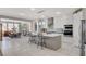 Beautiful kitchen with white cabinets, an island with seating, and stainless steel appliances at 8286 Skye Gorge St, Las Vegas, NV 89166