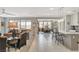 Spacious living room with tile flooring, open layout, and seamless connection to the kitchen and dining area at 8286 Skye Gorge St, Las Vegas, NV 89166