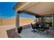 This covered patio offers outdoor seating and views of the gravel landscaping at 8286 Skye Gorge St, Las Vegas, NV 89166