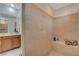 Spacious tiled shower area with a built-in bench and ample lighting at 8286 Skye Gorge St, Las Vegas, NV 89166