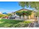 Lush backyard with well-manicured lawn and mature trees. Perfect for relaxing and entertaining at 8620 Cremona Dr, Las Vegas, NV 89117