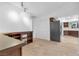 Bar area adjacent to kitchen featuring custom cabinets, lighting, and wine cooler at 8620 Cremona Dr, Las Vegas, NV 89117