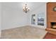 Dining room featuring decorative chandelier and fireplace at 8620 Cremona Dr, Las Vegas, NV 89117