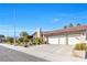 View of the home's driveway, landscaping, and exterior features at 8620 Cremona Dr, Las Vegas, NV 89117