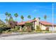 Desirable home with mature trees and landscaping under a bright blue sky at 8620 Cremona Dr, Las Vegas, NV 89117