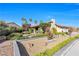 Attractive home featuring manicured landscaping, mature trees and vibrant colors at 8620 Cremona Dr, Las Vegas, NV 89117