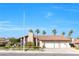Charming single-story home features a three-car garage, red tile roof, and mature landscaping at 8620 Cremona Dr, Las Vegas, NV 89117