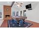 Warm, inviting living room with fireplace, pool table, and plenty of natural light at 8620 Cremona Dr, Las Vegas, NV 89117