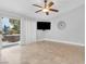 Living room with patio access and view of backyard seating area at 8620 Cremona Dr, Las Vegas, NV 89117